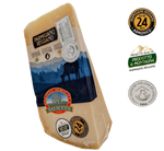 Renowned Italian Parmigiano Reggiano DOP cheese, aged for 24 months, presented with labels and a blue mountain background.