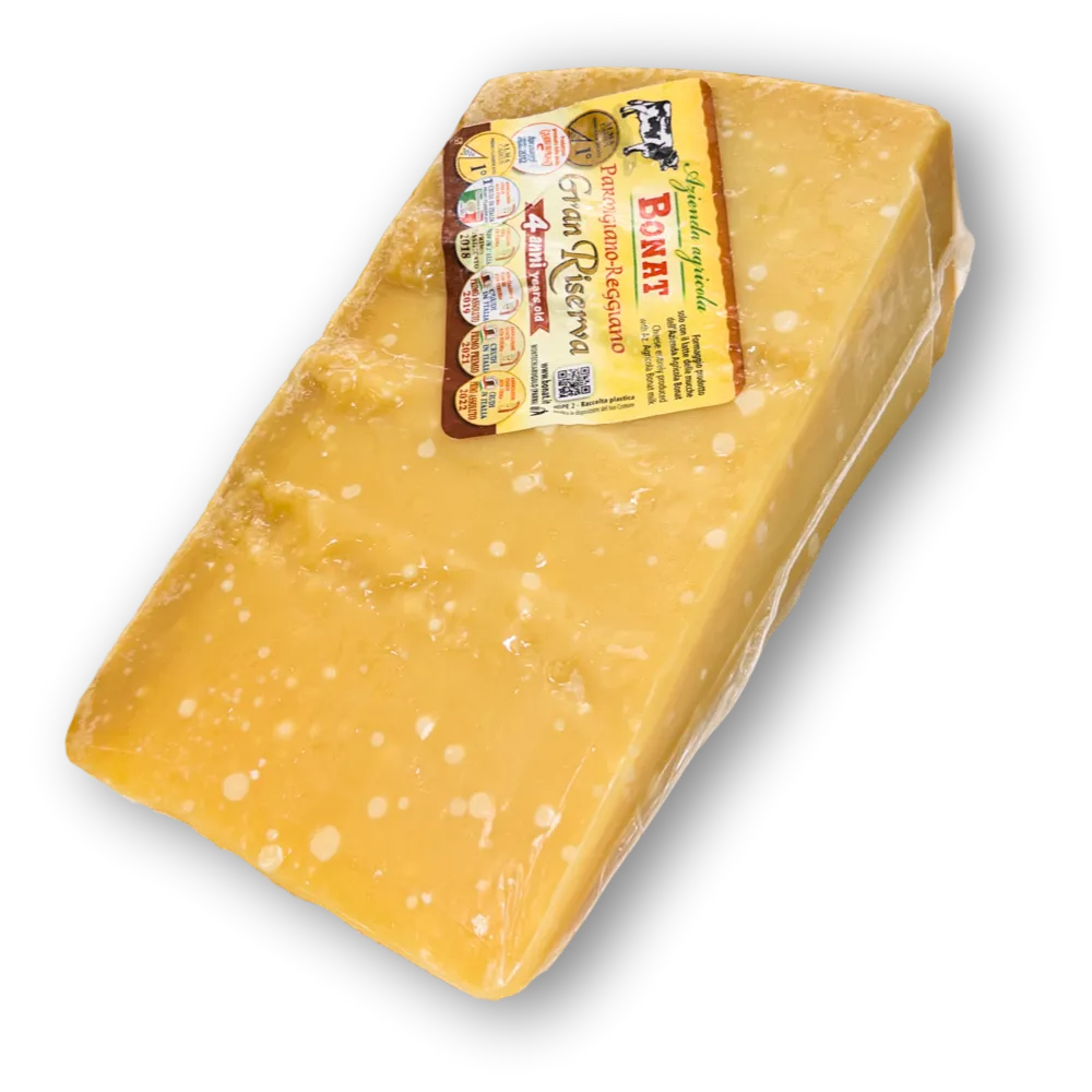 Punta di Parmigiano Reggiano DOP Bonat stagionato oltre 4 anni, di colore paglierino giallo intenso.