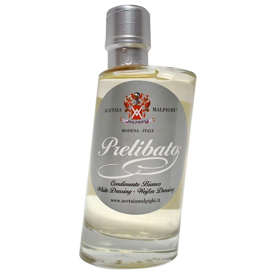 A bottle of refined Malpighi Prelibato condiment, ideal for enhancing both land and sea dishes, wrapped in a classy label.