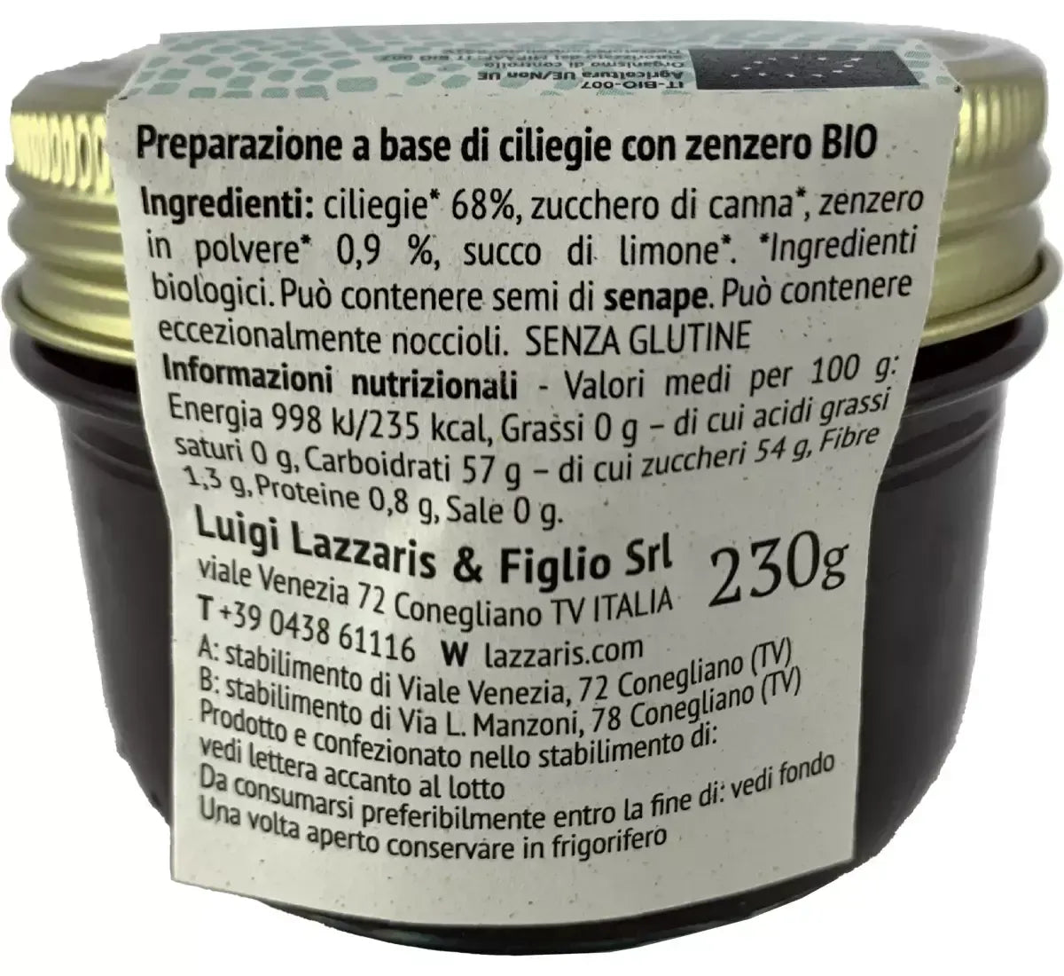 En krukke med økologisk saus med kirsebær og ingefær har en detaljert etikett med naturlige ingredienser og næringsverdier.