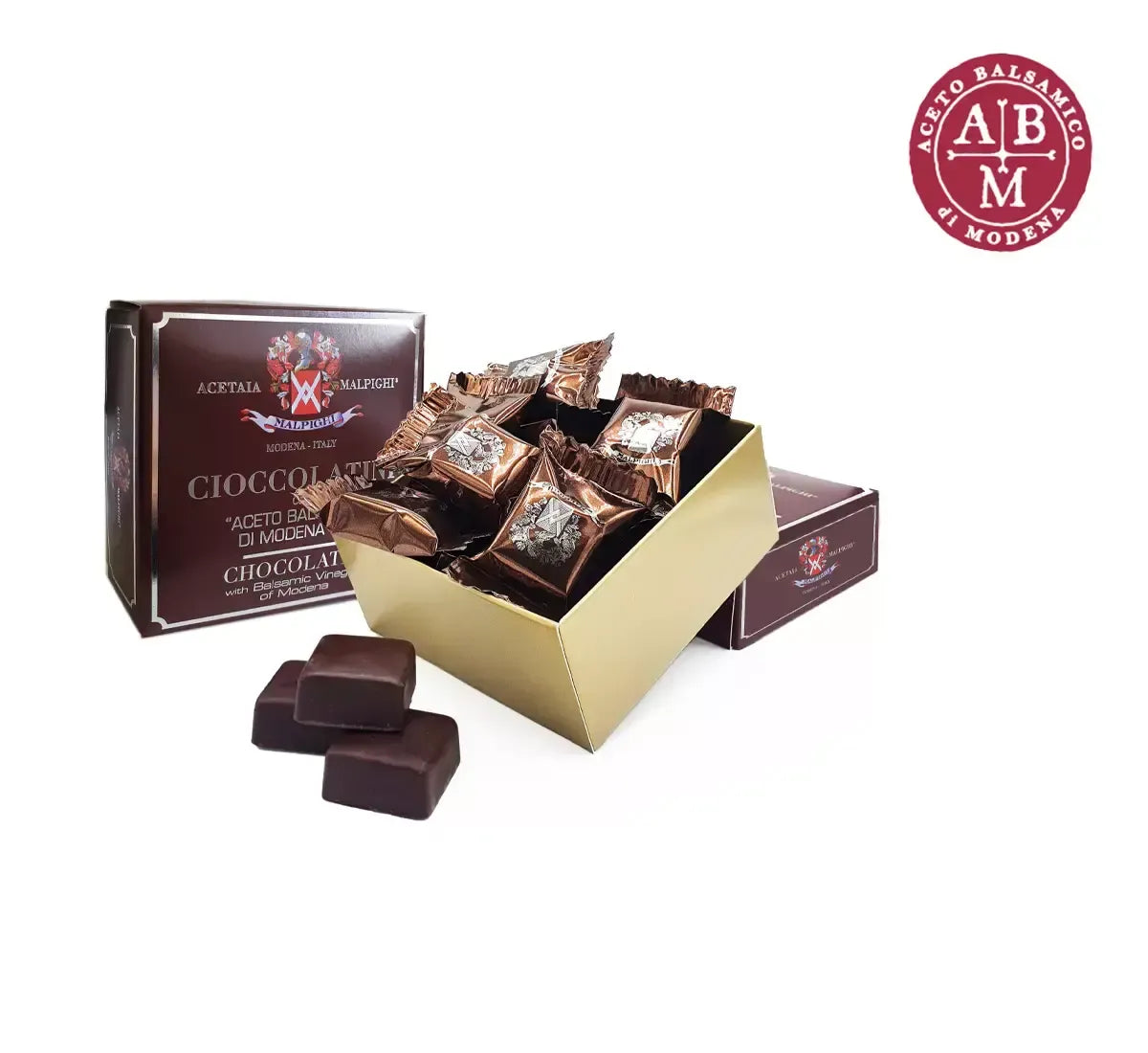 Una confezione elegante racchiude cioccolatini fondenti, arricchiti con Aceto Balsamico di Modena IGP, per un sapore unico e raffinato.