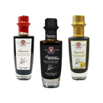 Edizione limitata di raffinate bottiglie Saporoso Anniversario, riempite con condimento balsamico, contraddistinte da etichette uniche e tappi vivaci.