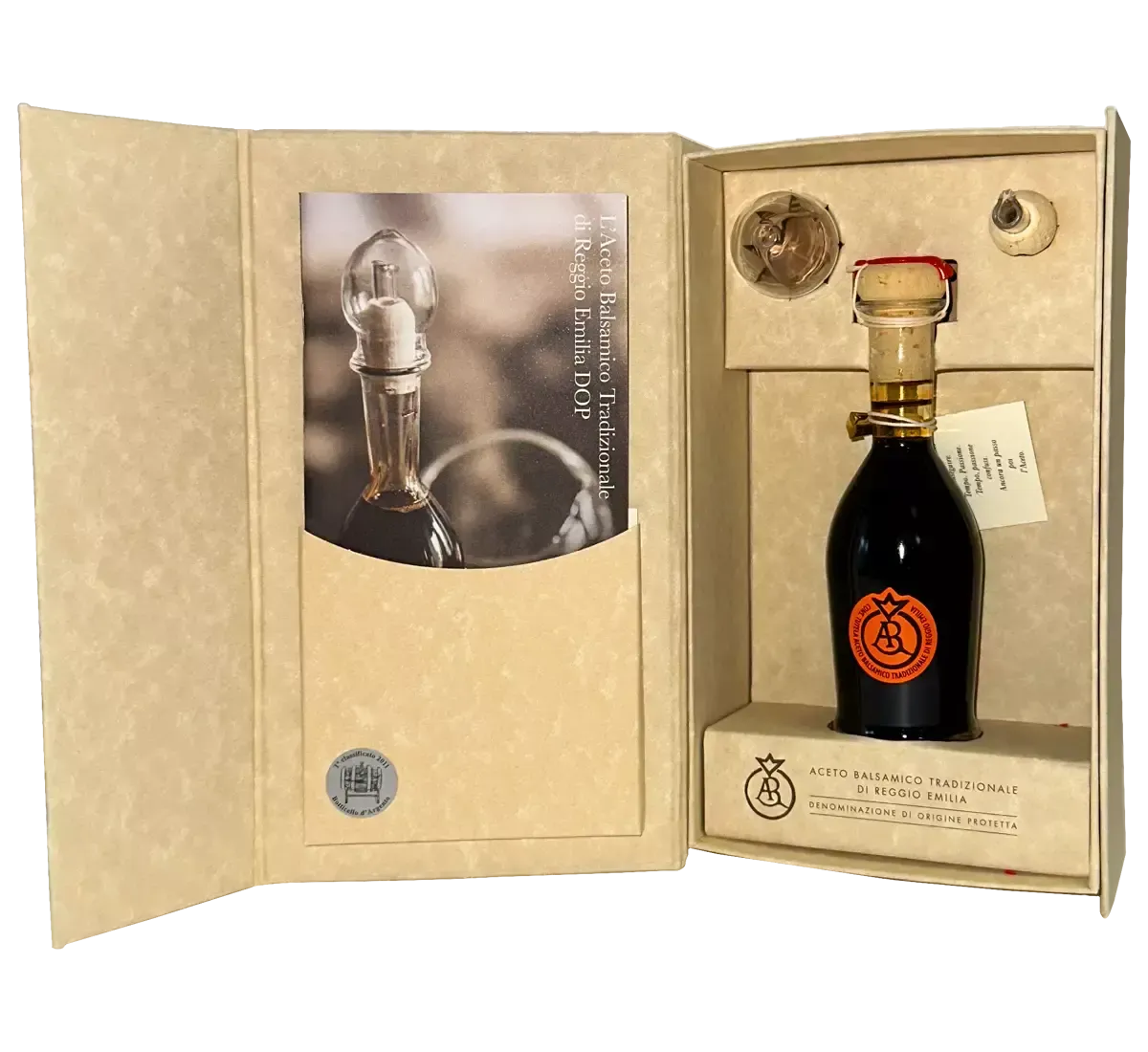 Una raffinata scatola aperta rivela un'elegante bottiglia di Aceto Balsamico Tradizionale di Reggio Emilia DOP, con etichetta Aragosta e tappo di sughero.