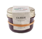 Barattolo di salsa biologica, fatta di ciliegie e zenzero, ideale per condire formaggi e carni bianche, con un gusto artigianale agrodolce.