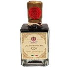 Una bottiglia di aceto balsamico IGP di Modena, dall'aspetto elegante, con tappo dorato e sigillo rosso. L'etichetta rivela la storicità della Casa Fondata nel 1850.