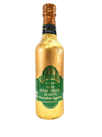 Una lussuosa bottiglia di olio extravergine Monocultivar Taggiasca, elegantemente avvolta in un incarto dorato e con una distintiva etichetta verde.