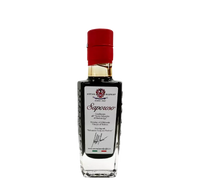 Saporoso aceto balsamico di Modena IGP, maturato per 6 anni, in bottiglia con etichetta bianca, tappo rosso e su sfondo nero elegante.