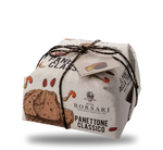 Midi Panettone tradizionale, avvolto a mano in una confezione di classe, impreziosito da uvetta e canditi, un autentico simbolo artigianale del Natale.