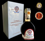 Elegante cesto regalo The King, contenente un raffinato aceto balsamico tradizionale D.O.P., invecchiato per 12 anni, presentato in una sofisticata bottiglia e cofanetto.