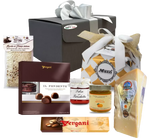 Confezione natalizia Valentino, contenente panettone, Parmigiano, risotto al tartufo, torrone, praline e marmellata d'arancia.