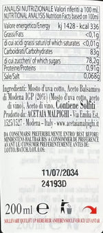 Una etichetta di condimento Saporoso rivela ingredienti e valori nutrizionali, esprimendo l'eleganza modenese in ogni goccia.