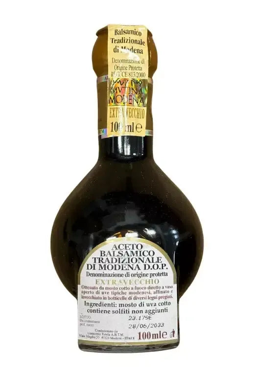 A 100 ml bottle of Extra Old Traditional Balsamic Vinegar of Modena PDO, produced organically and biodynamically, with a distinctive label.