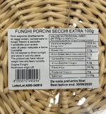 L'etichetta di una confezione da 100g di funghi porcini secchi, di qualità extra, mette in evidenza i valori nutrizionali, l'uso suggerito e la data di scadenza.