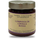 Un barattolo di pregiata composta di cipolla rossa, impreziosito da un'etichetta raffinata. Perfetto per esclusivi regali gourmet natalizi.
