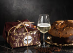 Panettone artigianale di lusso con uvetta macerata nello Champagne in confezione regalo.