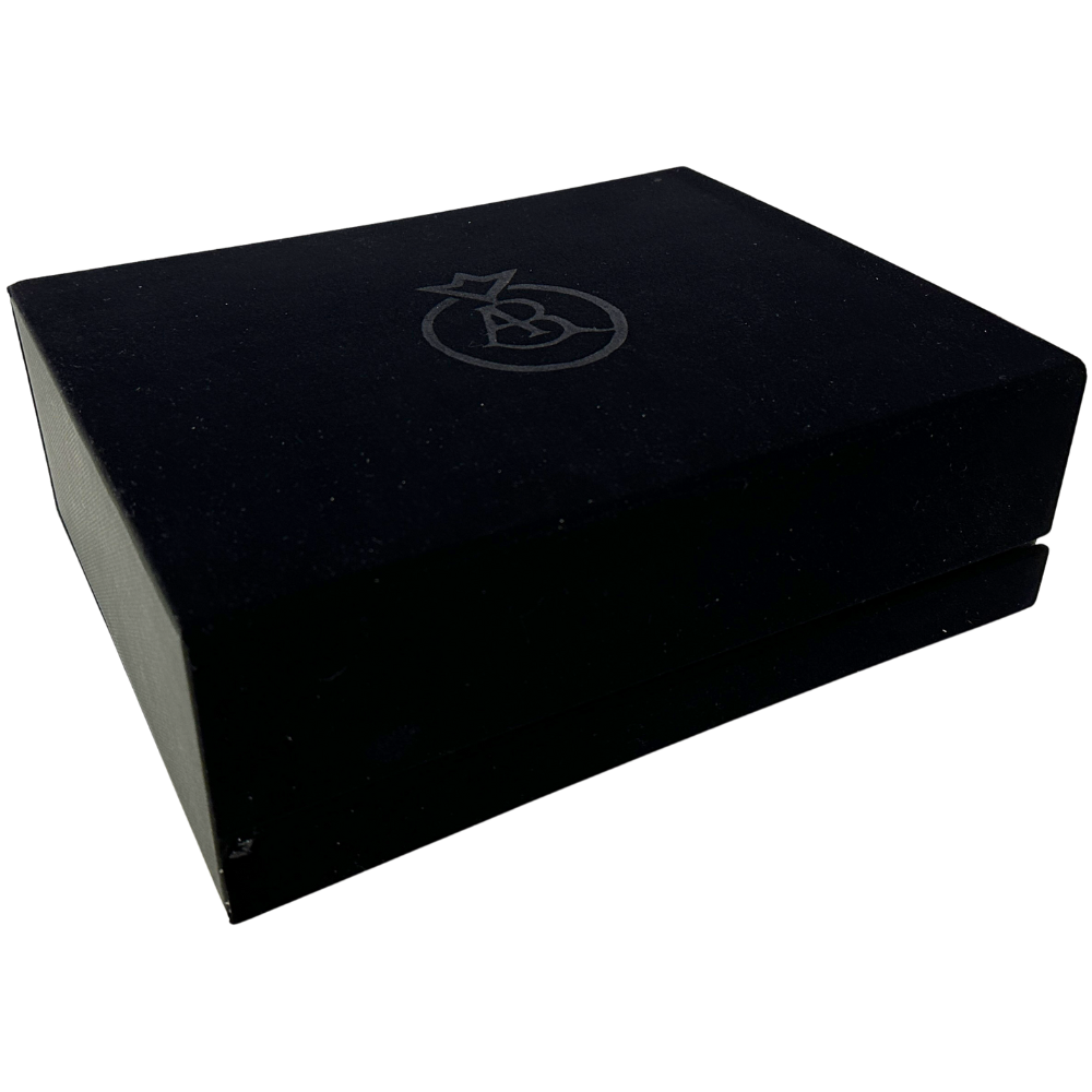 Closed black velvet box containing three small bottles of Traditional Balsamic Vinegar of Modena PDO.